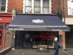 Jordan's Woodflooring, Wandsworth Bridge Road Recover client's existing awning with logo and signwriting