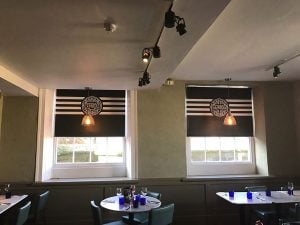 2 interior roller blinds of Pizza Express restaurant as seen from inside