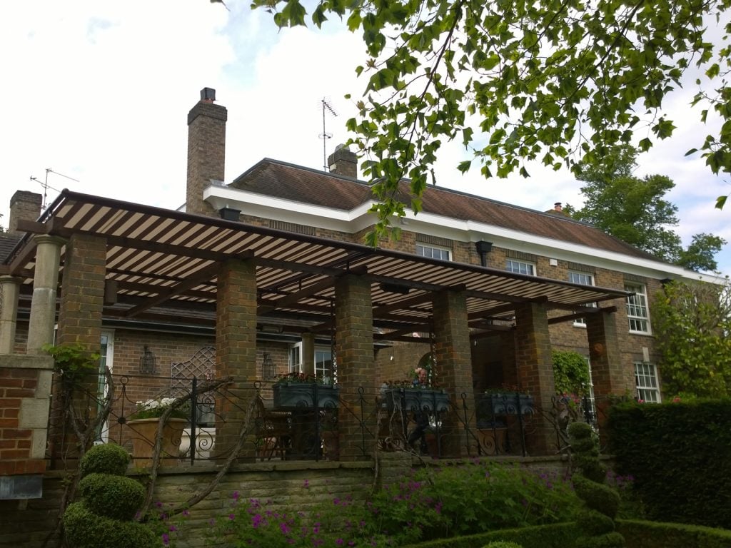 Wooden Pergola covered by retractable awning