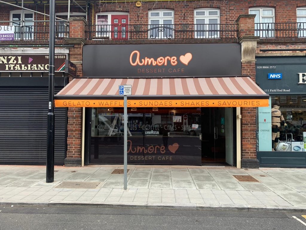 Pink-striped coffee shop awning