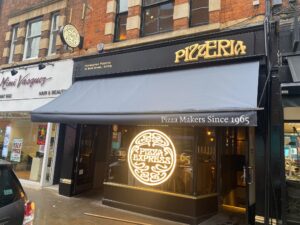 Recovered black restaurant awning of pizza restaurant