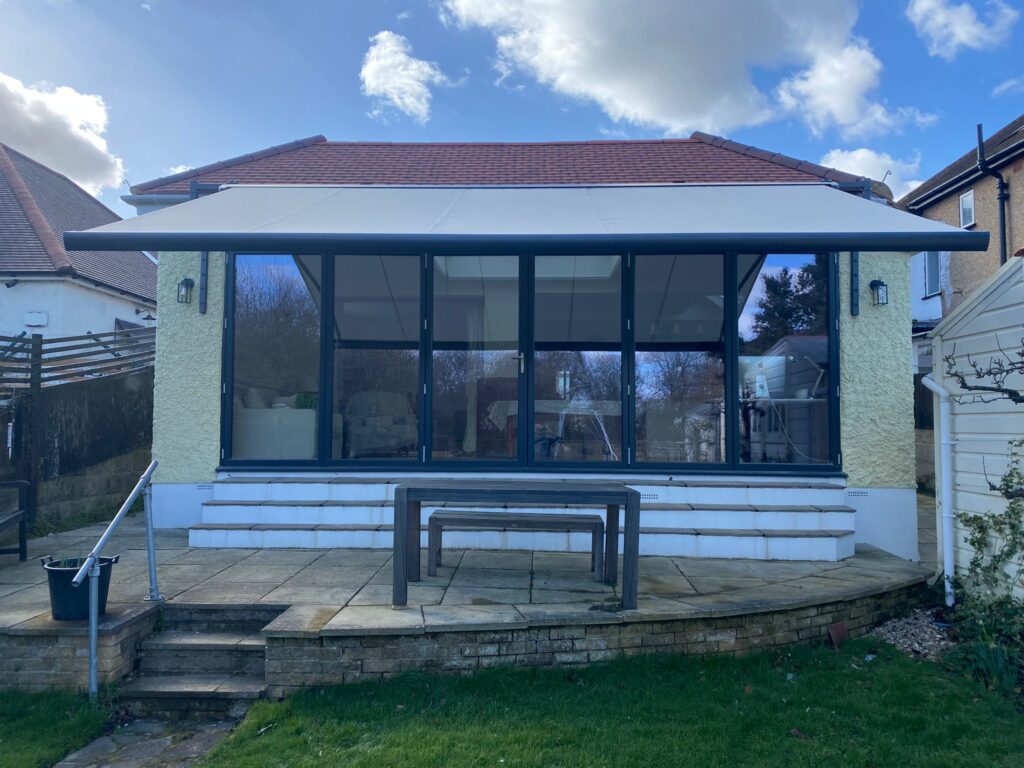 Front view of patio awning with two bespoke gutter brackets