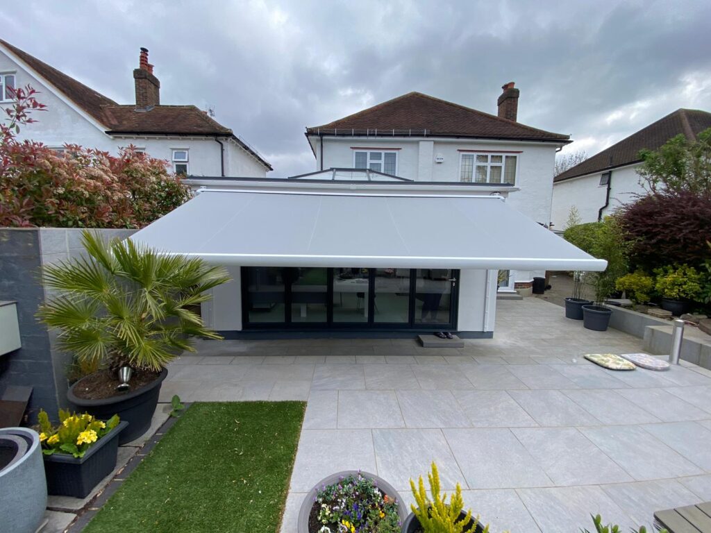 Front view of white, wide patio awning of house