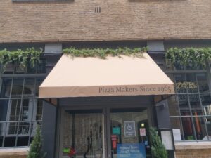 Front view of khaki-colored restaurant awning