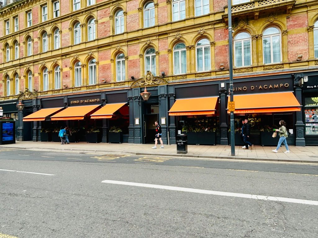 Gino D’Acampo orange restaurant awnings view from other side of street