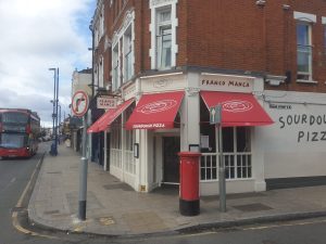 Red awnings of pizza restaurant