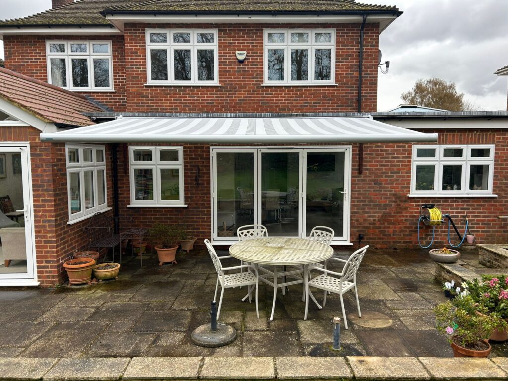 Grey and white striped patio awning front view