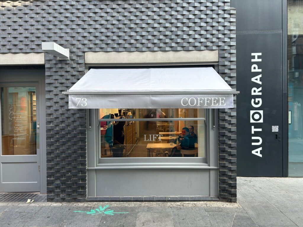 Front view of grey awning of coffee shop